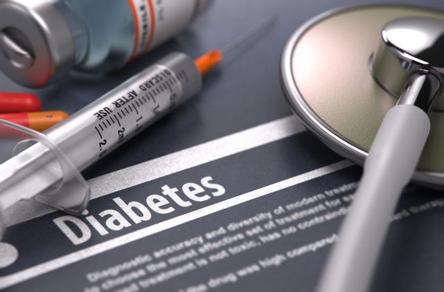 diabetes on table with medical paraphernalia